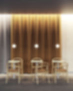 globe pendant lights hanging over dining tables with gold curtains