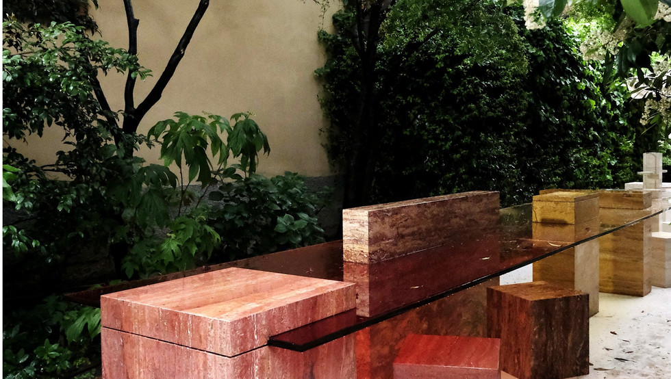 designer table with colored marble and tinted glass