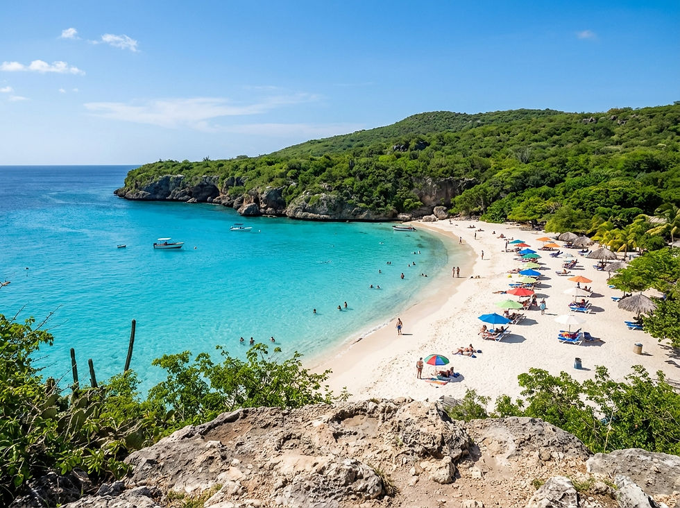 elevated view, turquoise water and white sand of Grote Knip beach, beachgoers relaxing, lush green cliffs surrounding the cove, vibrant daylight, landscape 485x363
