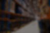 interior-large-distribution-warehouse-with-shelves-stacked-with-palettes-goods-ready-marke