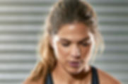 Sporty Woman Lifting a Medicine Ball