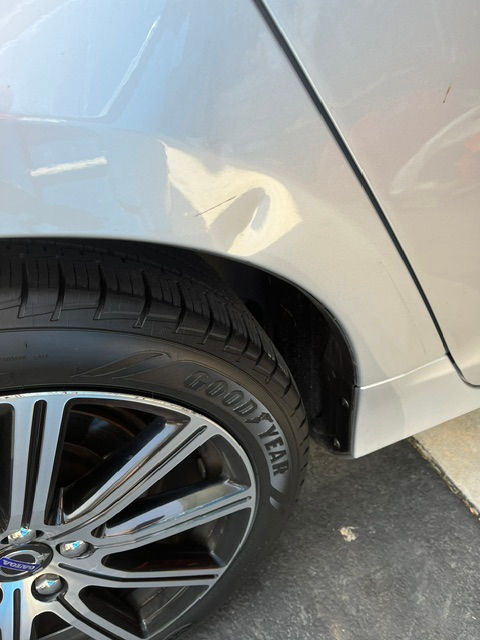 Auto body technician completing a mobile dent repair