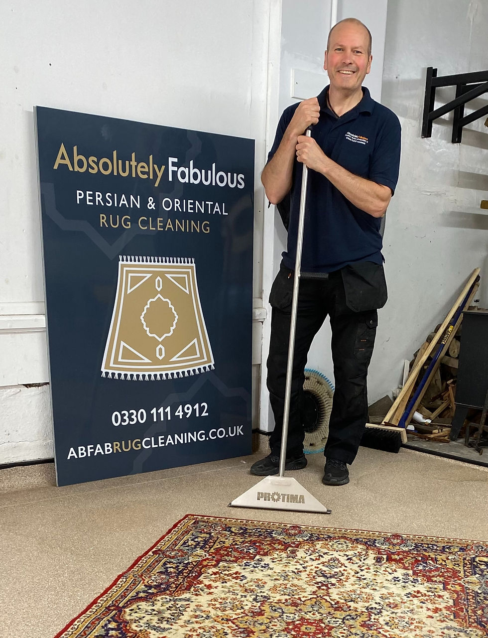 Man with oriental rug and business sign