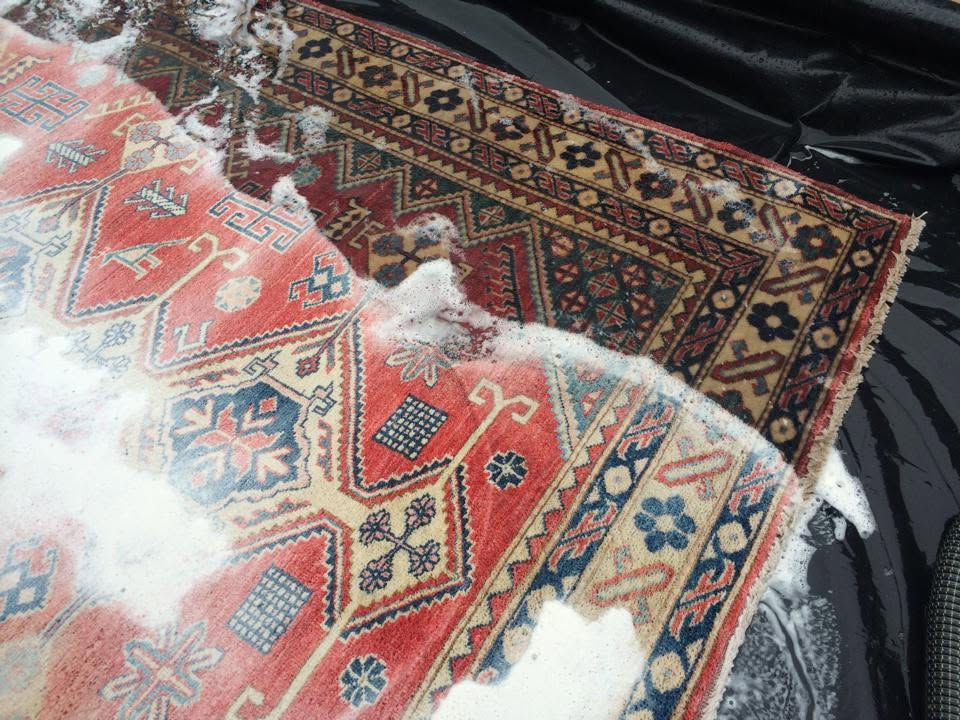 Rug being cleaned professionally