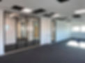 Large window frames and windows fitted into commercial office