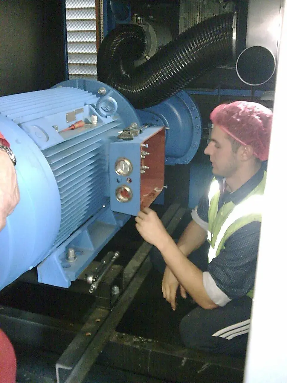 engineer working on compressor