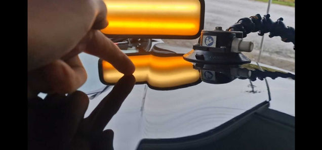 Black BMW dent to be repaired on bonnet