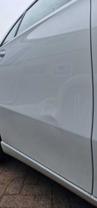 View of dent in car door