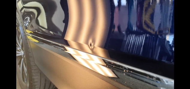 Different view of dent in car door