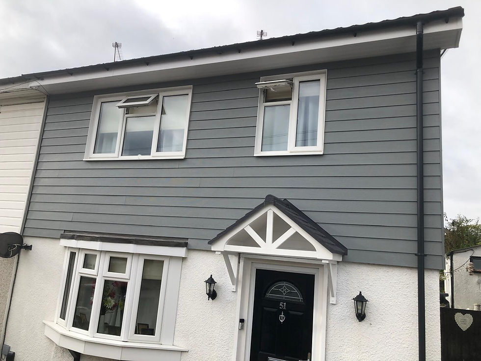 Deep grey cladding on front of house