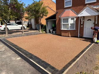 Completed resin driveway and paved border