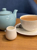 Tea pot and cup