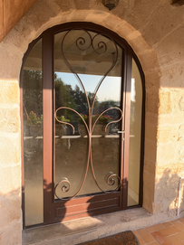 Porte cintré en acier, Serie 55 RP TECHNICK,
Thermo laqué et fer forgé