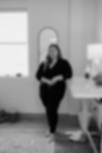 Woman standing by a desk indoors