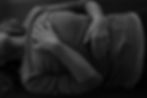 Person lying down, hands on stomach