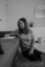 Woman writing on a notepad, smiling