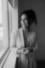 Smiling woman looking out a window