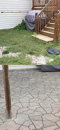 Before and after showing cleaned patio stones.