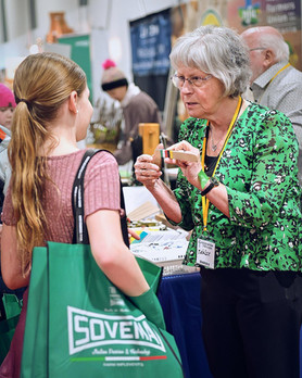 Woman discussing products at the Sovera Ottawa Farm Show