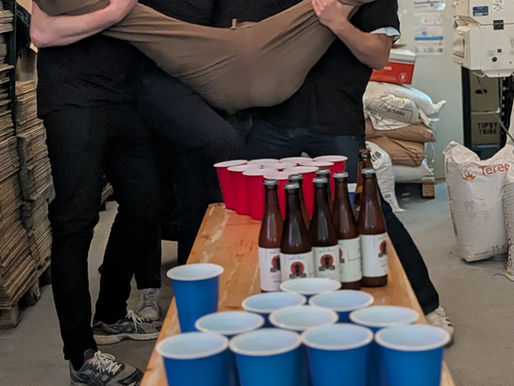 Bachelor party activity, with men playing beer pong at Tipsy Tribe Brewery & Distillery in Brussels