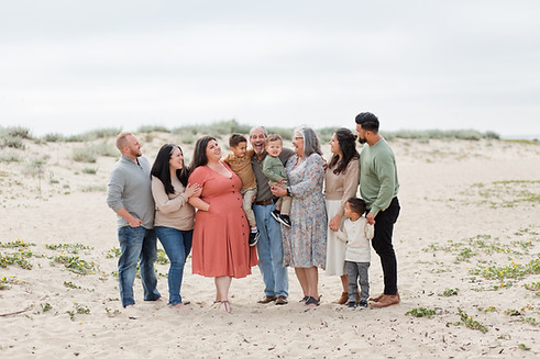 hk create photography bay area beach legacy extended family looking at each other laughing