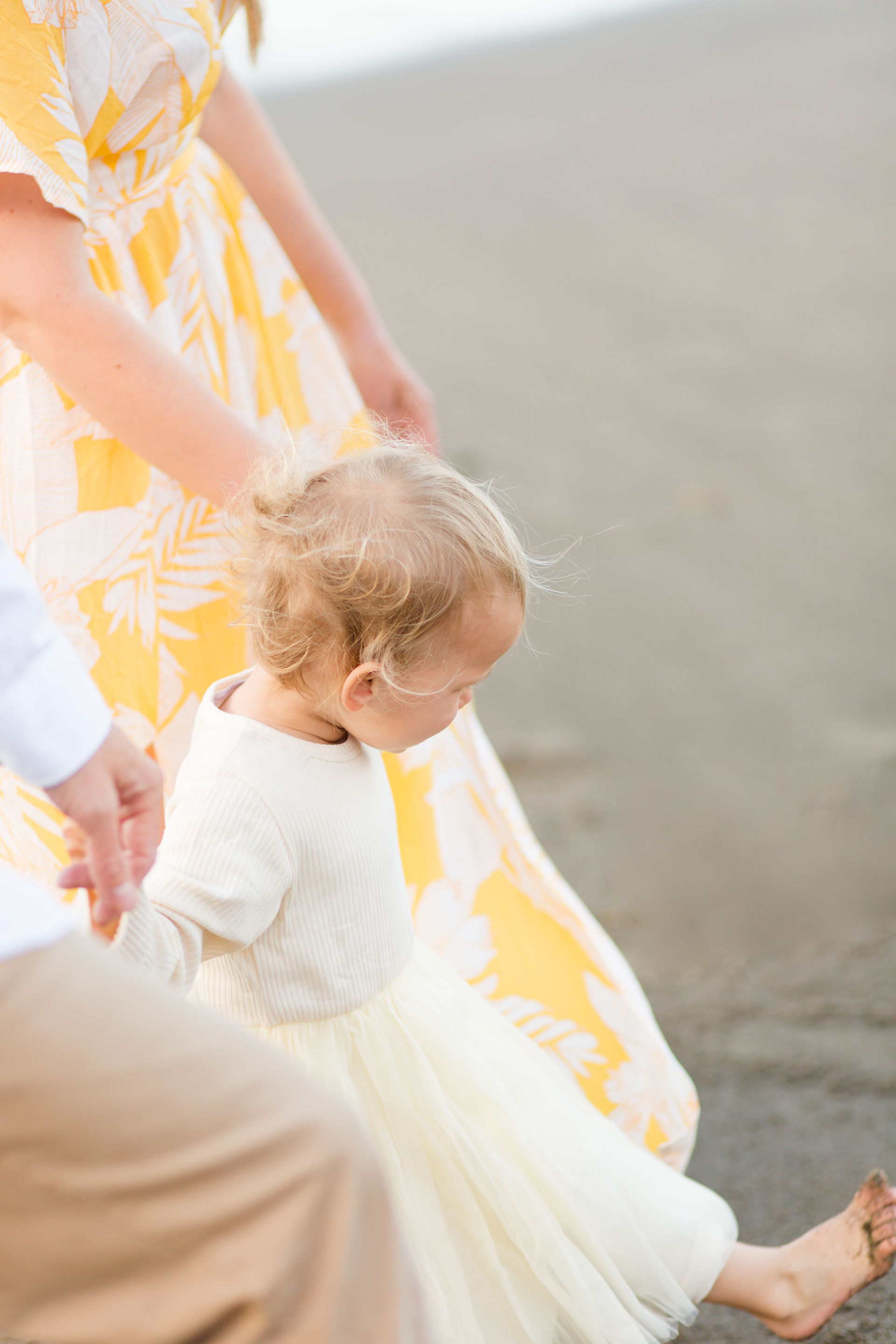 hkcreate hk create heather and kissy photography duo bay area family photographers mini session beach rockaway beach pacifica yellow and cream outfits family of three loving sweet cute joyful light and airy