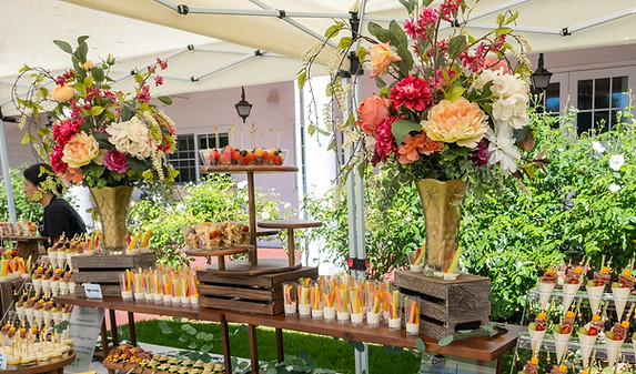 Large tropical florals at dessert bar