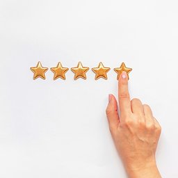 A hand with light pink nail polish pointing at the fifth star in a row of five golden stars on a white background, symbolizing a five-star rating or positive customer review.