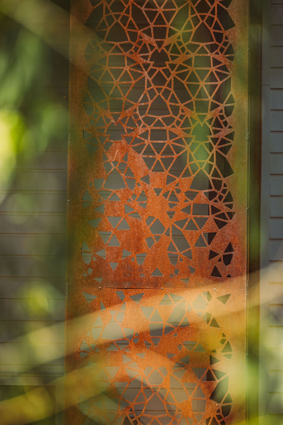 A delicate metal screen inspired by the molecular structure of the gemstone tourmaline