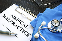 Medical malpractice. Medical suit, stethoscope and documents..jpg