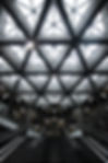 Architectural ceiling with geometric concrete beams and skylights in a modern Montreal building, symbolizing structure and leadership in executive recruitment
