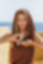 Model with flawless skin holding Zartaux Botox like Serum, luxury skincare product
