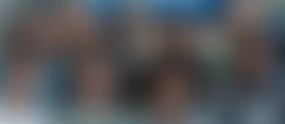 Image of confident parents standing tall with legal documents.