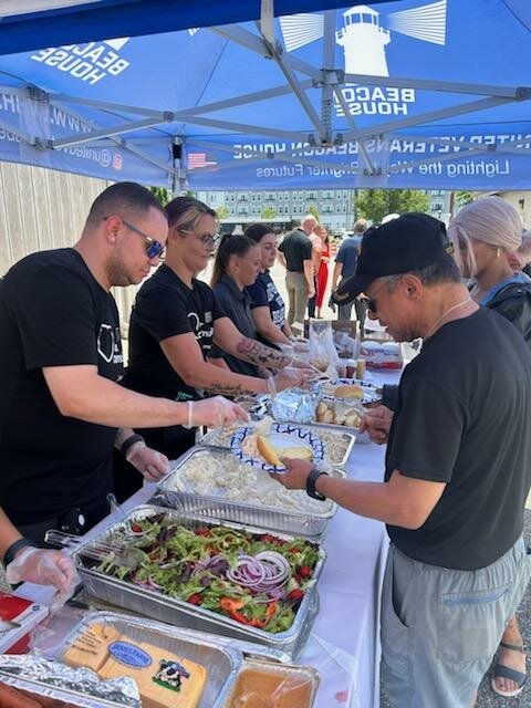 Veterans and supporters are served classic Fourth of July fare by volunteers from Stop ‘N Shop and National Grid. Photo courtesy of United Veterans Beacon House.