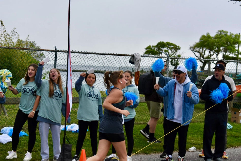 Rowdy cheerleaders lined the finish line, enthusiastically encouraging participants to finish strong.
