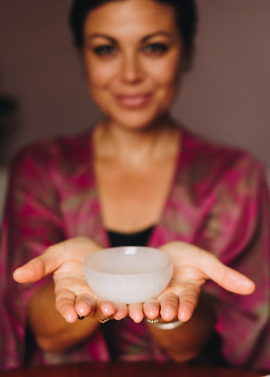 Ayesha holds bowl of massage oil