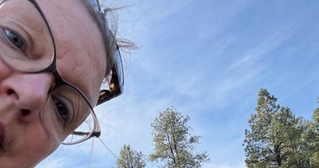 Woman waiting for her pregnant cow to calve