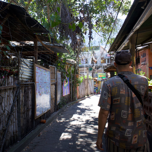 empty alley way with a jumble of buildings either side