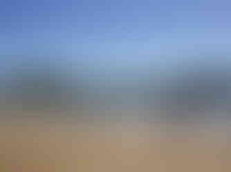 a man walks along a beach