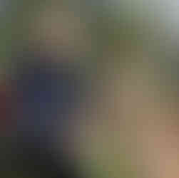 man feeding hungry wallaby with dissapointed wallaby nearby