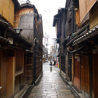 wooden building with cobbled pavestones
