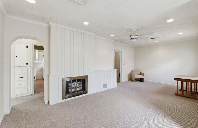 Second angle of living room before professional home staging