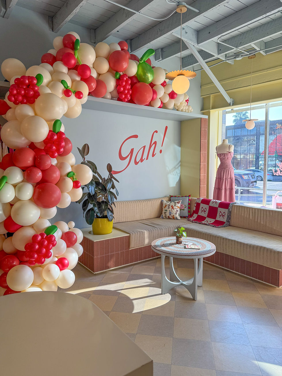 fruit themed balloon arch in a cafe