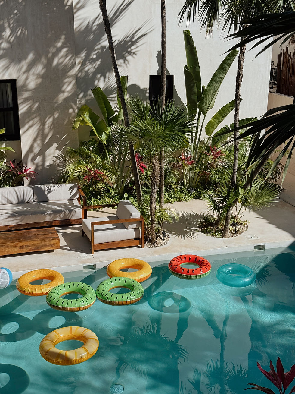 tropical pool with fruit themed floaties