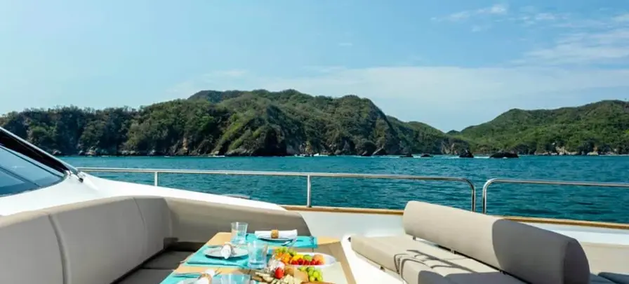 Outdoor lounge and dining area on the Sunseeker 28 Metre yacht in the Sea of Cortez