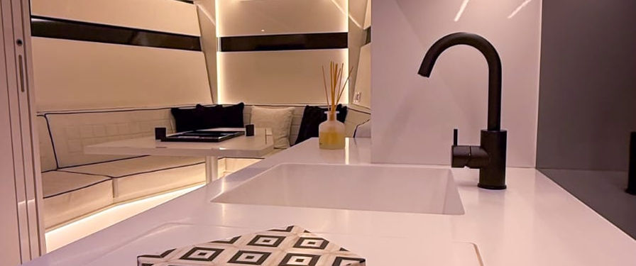 En-suite kitchen and living area aboard the Mamba Bianca VanDutch 48
