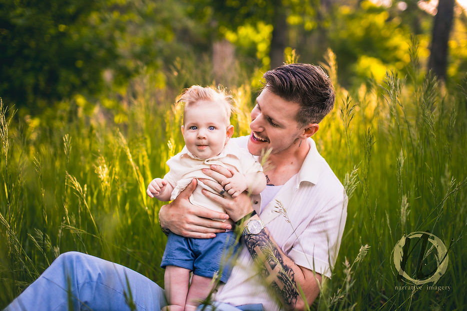 Denver family photographer captures father and baby in field