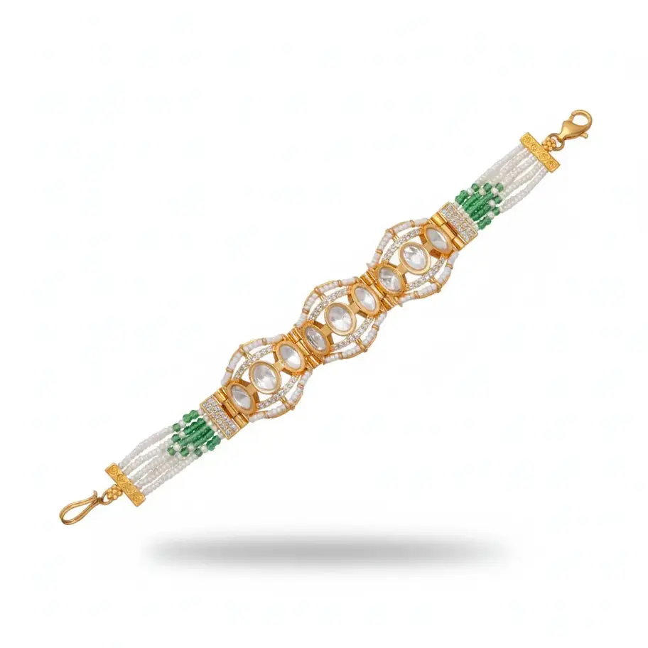 Flat lay of gold Kundan bracelet with white pearls and green beads on pure white background.
