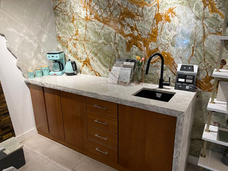 Coffee bar, blue appliances, green marble wall