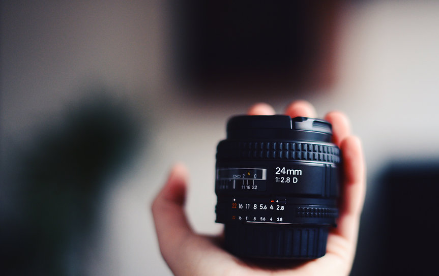 hand holding lens